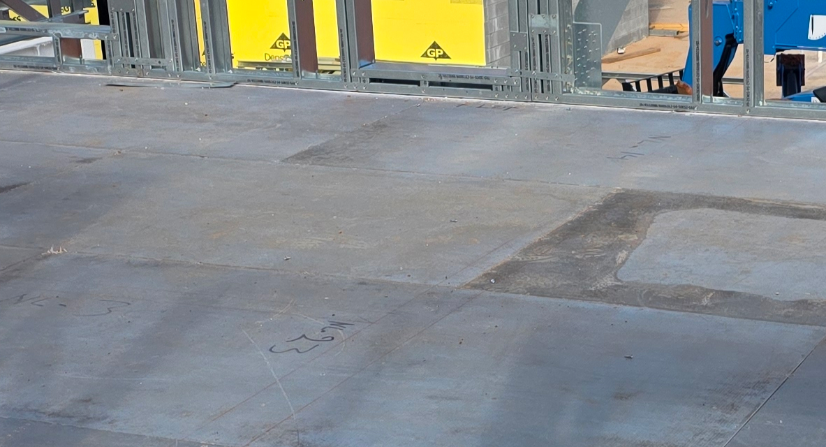 Workers installing MAXTERRA MgO panels on cold-formed steel framing at an assisted living facility construction site in Winder, GA